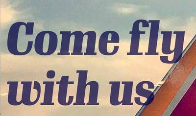 Text slightly overlapping the tail section of a Southwest Airlines jet