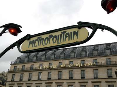An image a classic Art Nouveau-style Metropolitain entry sign in Paris
